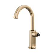 Luxe gold bar faucet with curved arc spout and single handle control on white background.