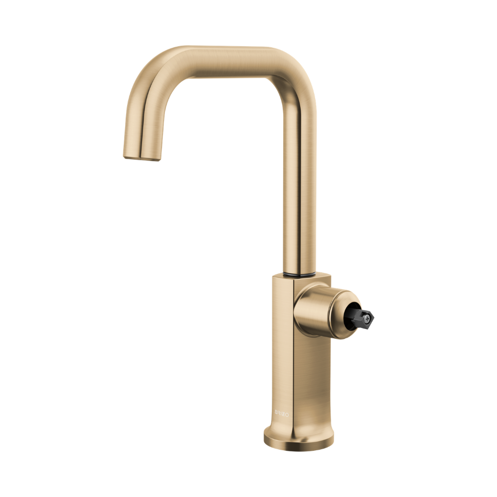 Gold bar faucet with square spout and single round handle on cylindrical base.
