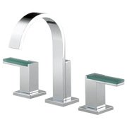Chrome widespread lavatory faucet with tall arched spout and two green-handled side valves on square bases.