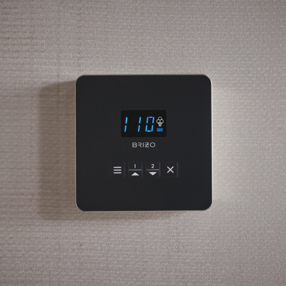Square black steam control panel with blue digital display, Brizo branding, and buttons for menu, temperature adjustment, and