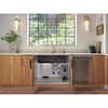 Wooden cabinet with two doors and open shelving, displaying decorative items and storage baskets.