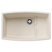 Soft white undermount kitchen sink with curved front, single basin, and chrome drain fixture.