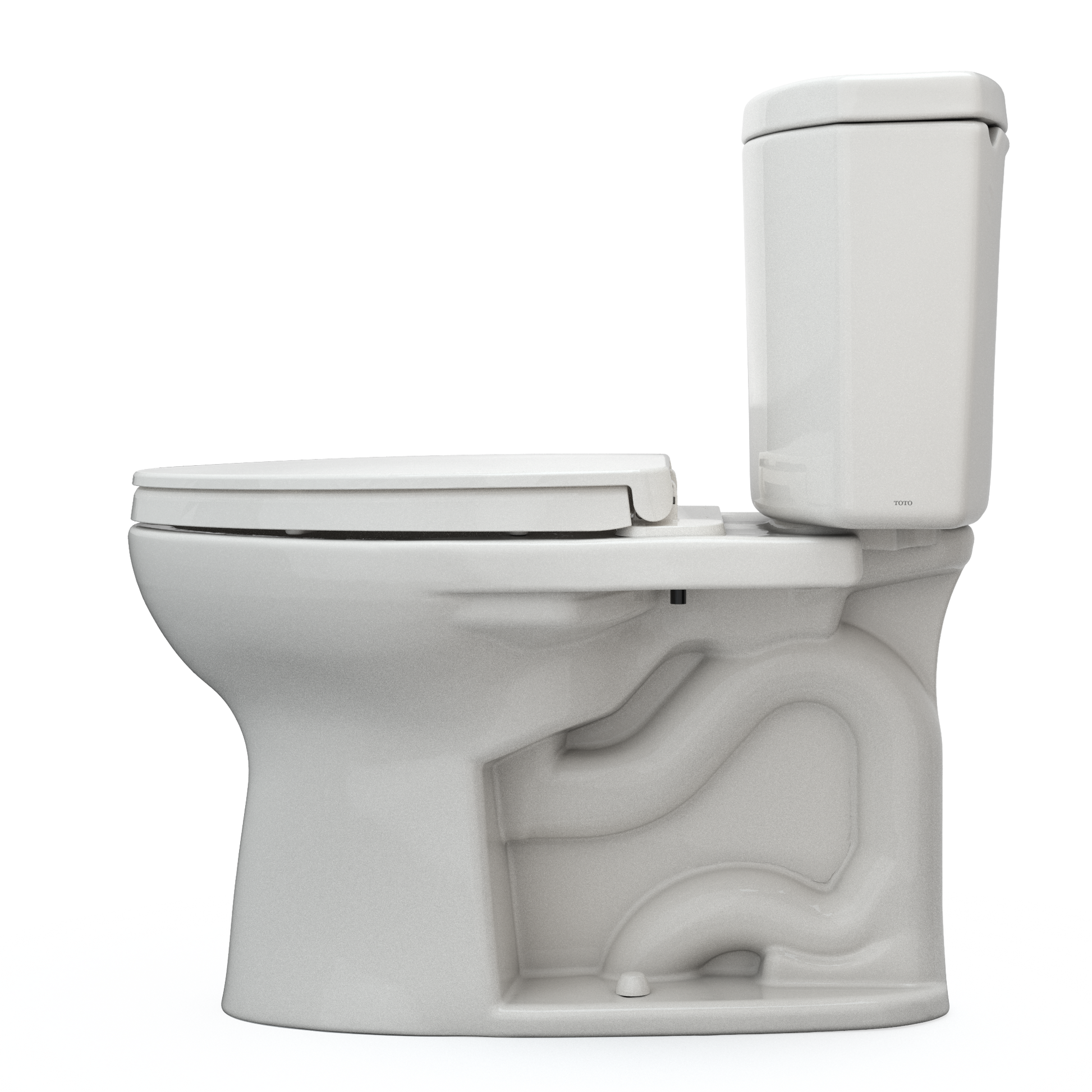Sedona beige two-piece elongated toilet with soft-close seat and separate tank, shown from angled side view.
