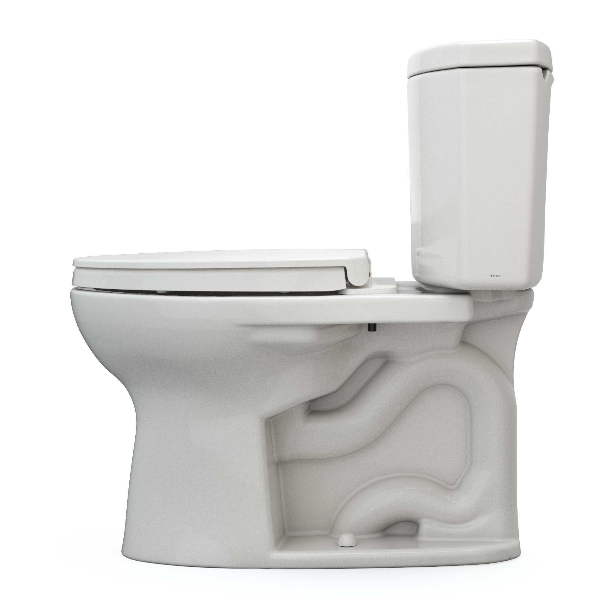 Sedona beige two-piece elongated toilet with soft-close seat and separate tank, shown from angled side view.