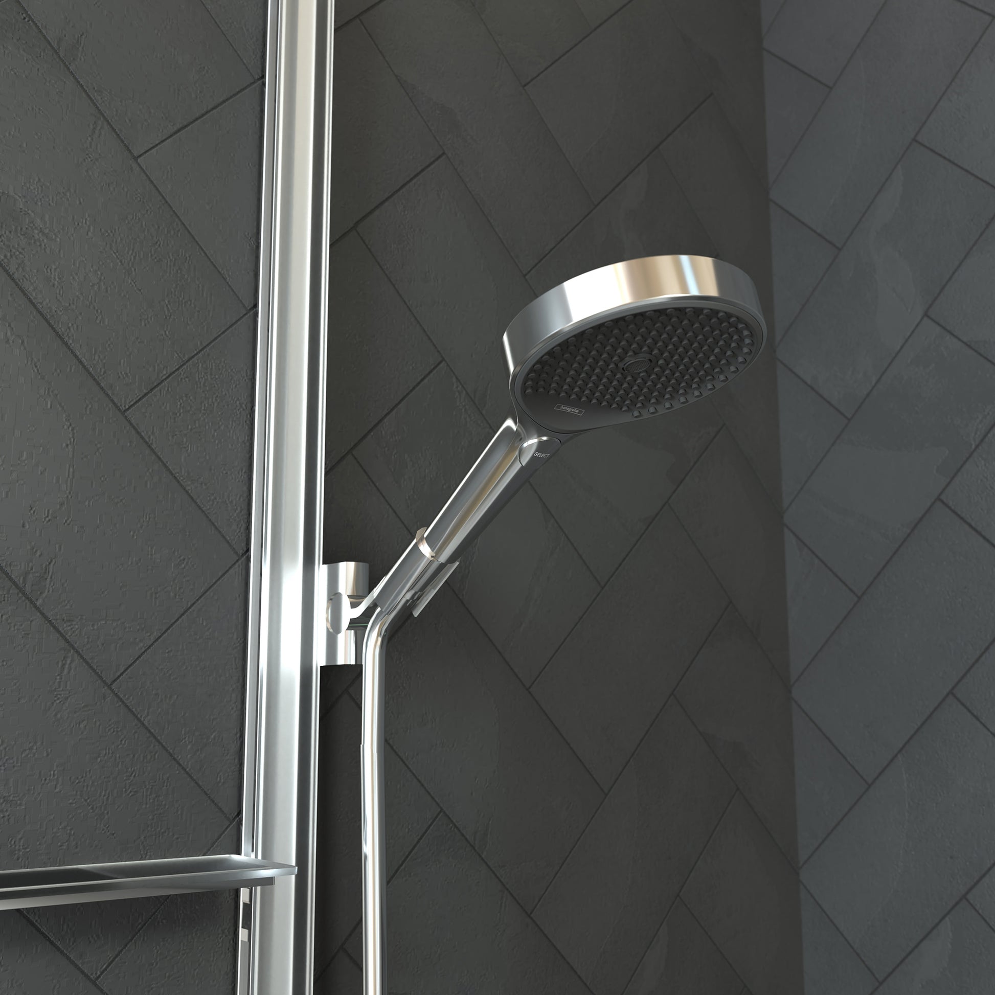 Chrome handheld showerhead with perforated face mounted on vertical rail against herringbone tile wall.