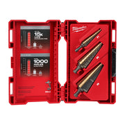 Three cobalt step drill bits with gold flutes in an open red Milwaukee carrying case with performance charts on the left pane