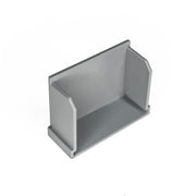 Gray rectangular linear drain component with sloped interior walls and mounting flanges.