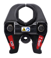 Black and red Milwaukee M18 press jaw with hexagonal opening, dual connection points, and safety warning labels.