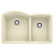Biscuit-colored undermount kitchen sink with two unequal bowls and chrome drain strainers.