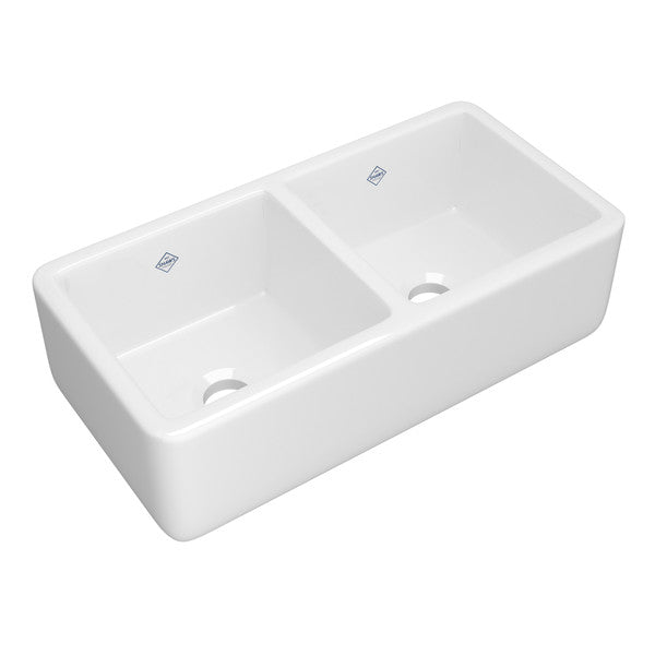 White fireclay apron front kitchen sink with two equal bowls and drainage holes.