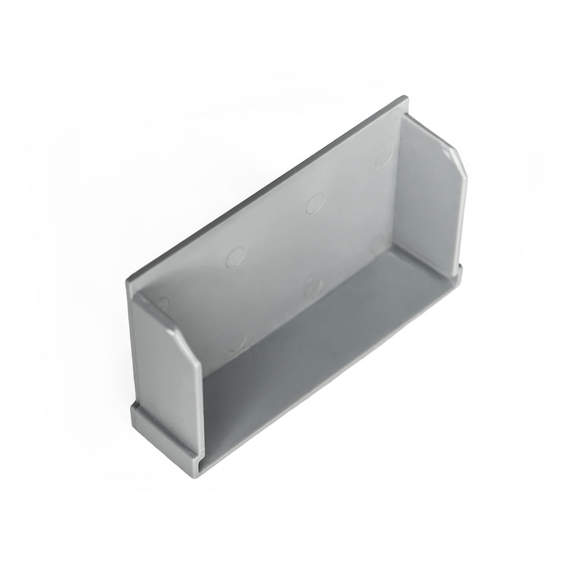 Gray plastic linear drain component with rectangular basin and mounting holes on interior walls.