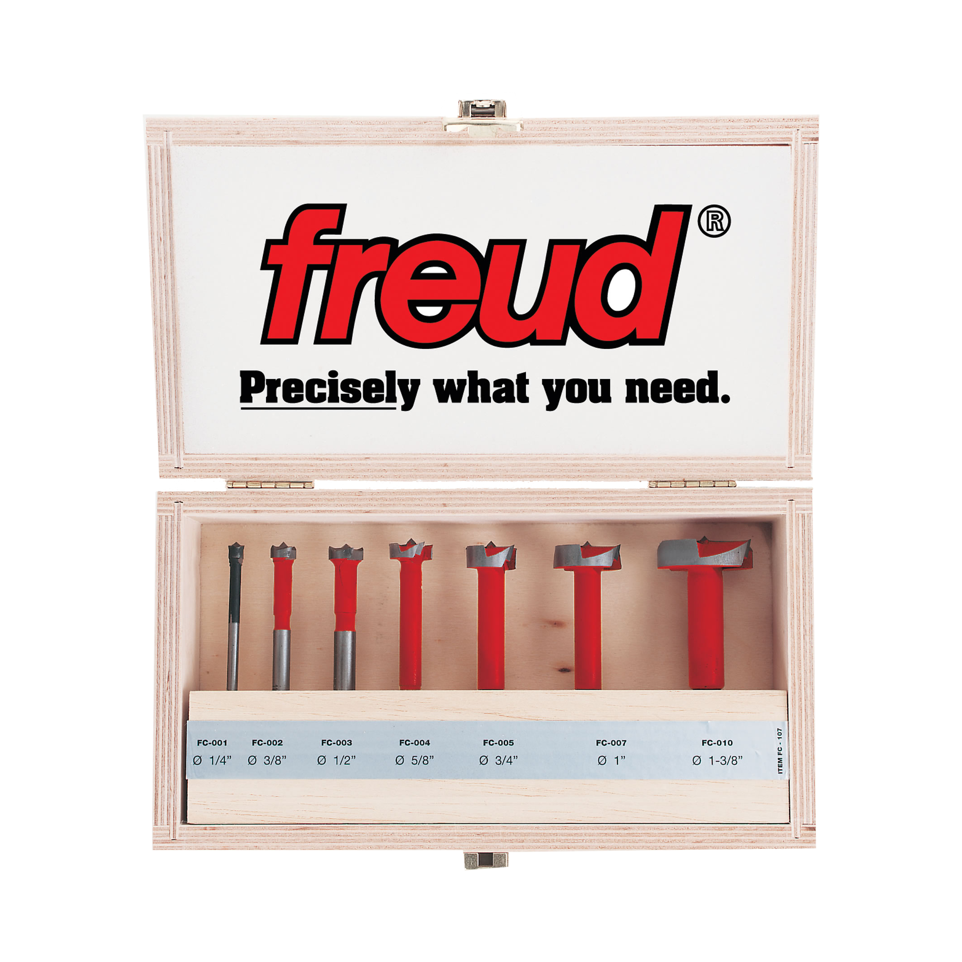 Seven Freud Forstner bits with red handles and gray cutting heads in wooden storage case with labeled compartments.