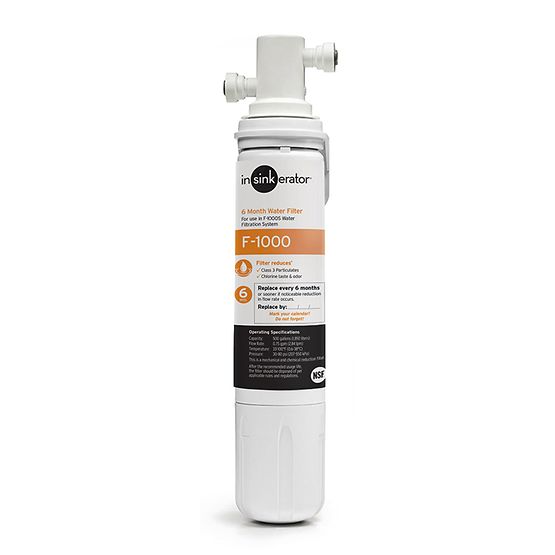 InSinkErator F-1000S white water filtration system with label showing filter replacement information and connection ports.