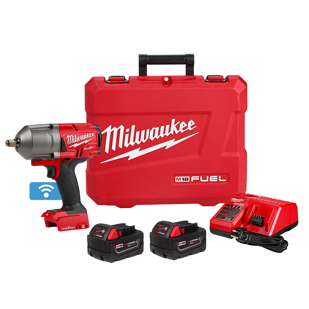Milwaukee M18 FUEL impact wrench kit with two batteries, charger, and red carrying case.
