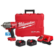 Milwaukee M18 FUEL impact wrench kit with two batteries, charger, and red carrying case.