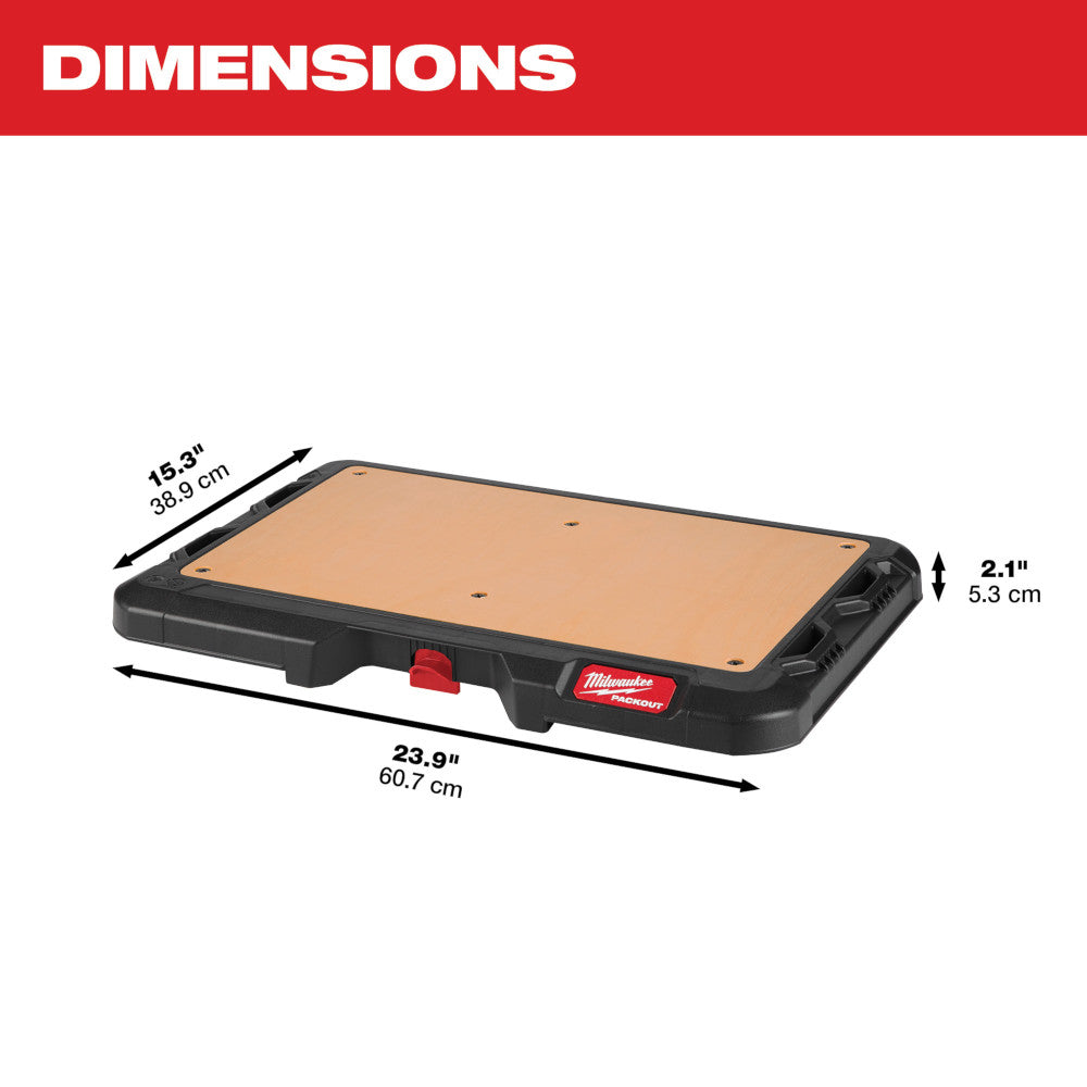 Black PACKOUT work top with tan surface and storage compartments, 23.9" long by 15.3" wide by 2.1" tall.