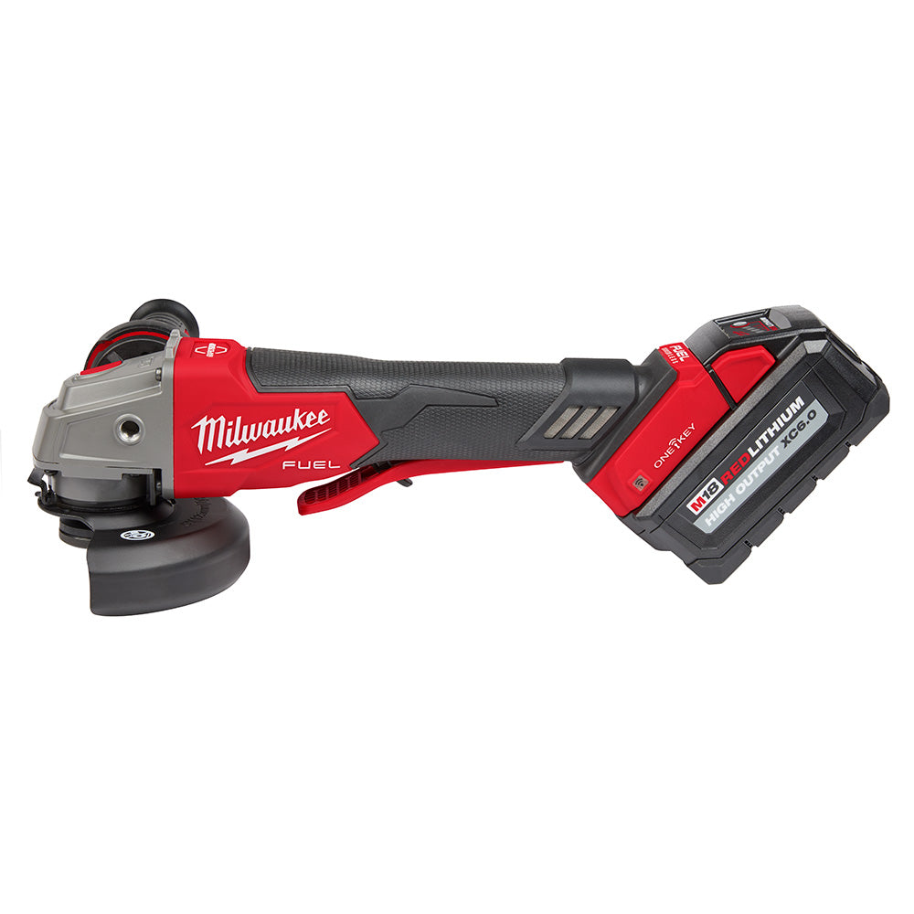 Milwaukee M18 FUEL cordless angle grinder with red and black body, paddle switch, and detachable battery pack.