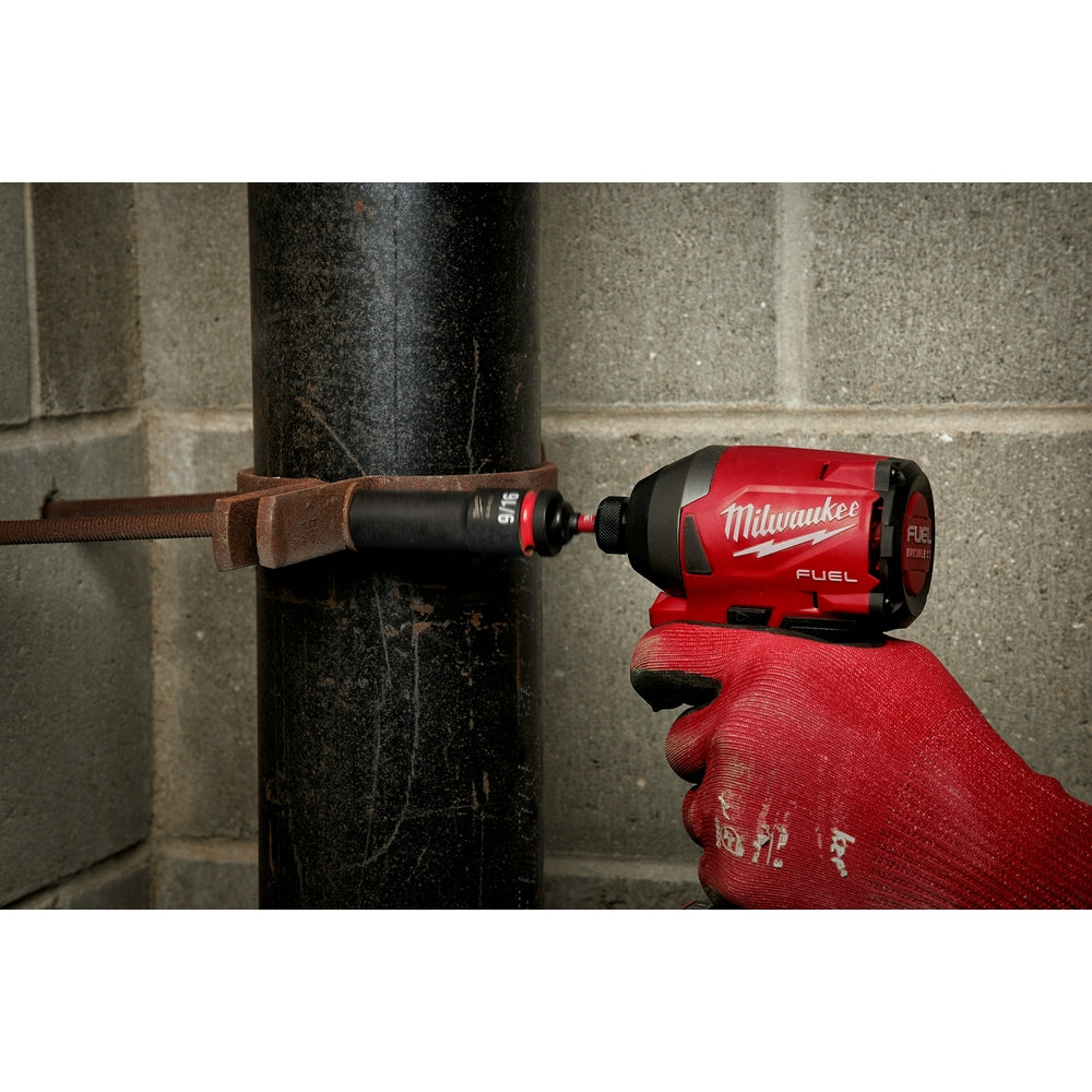 Black and red Milwaukee socket adapter with 1/4 inch hex and 1/2 inch square drive ends shown in use on impact driver.