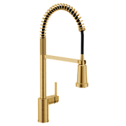 Brushed gold kitchen faucet with coiled spring spout and single handle lever.
