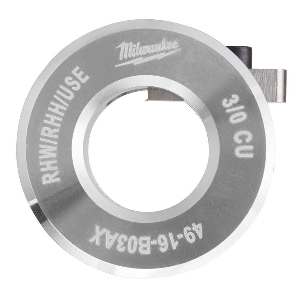 Circular metal bushing with central hole, labeled "Milwaukee," "RHH/RHH/USE," and "3/0 CU" with two small attachment tabs.
