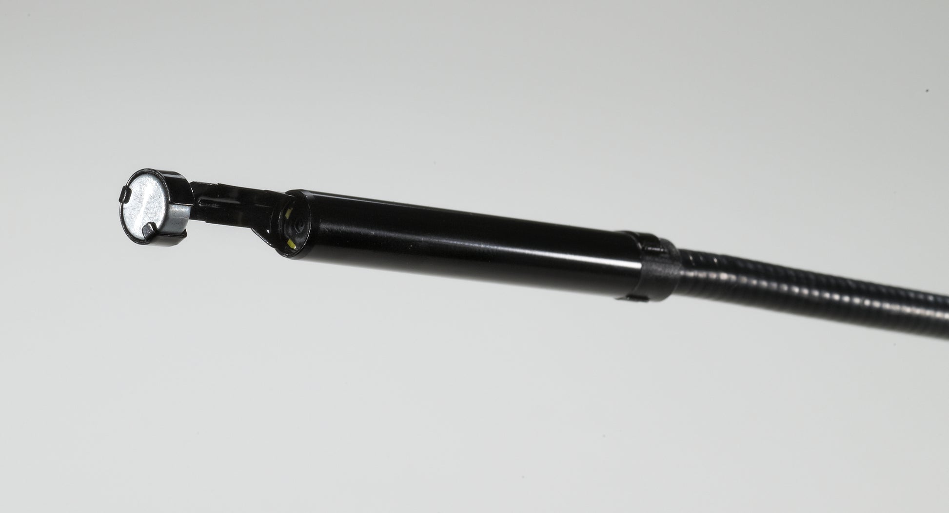 Black Milwaukee M-Spector 360 scope head attachment with white LED light and flexible extension shaft.