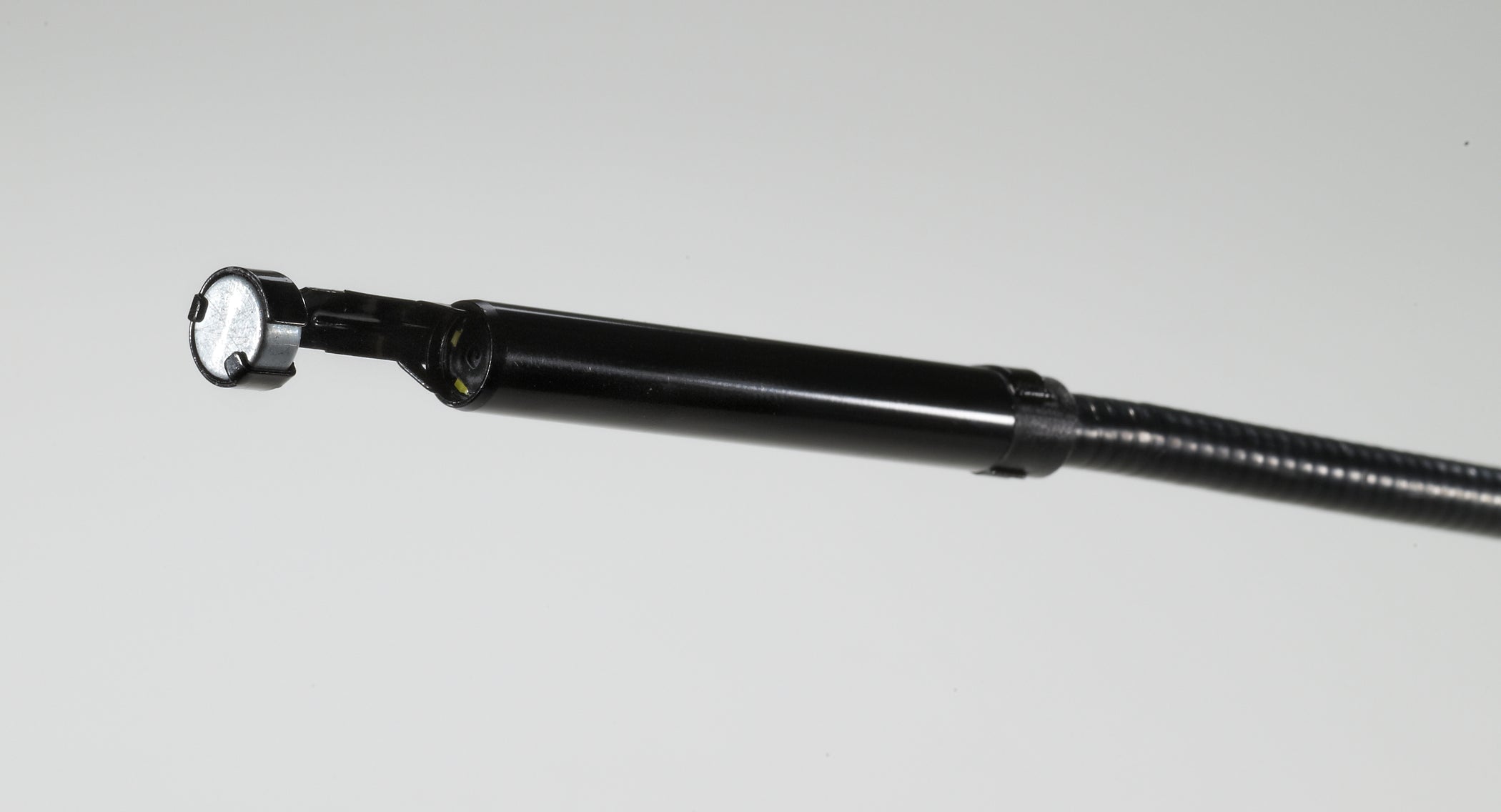 Black Milwaukee M-Spector 360 scope head attachment with white LED light and flexible extension shaft.