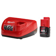 Red Milwaukee M12 charger with black base next to red and black M12 REDLITHIUM 2.0Ah battery pack.