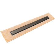 Oil rubbed bronze linear drain with rectangular frame mounted on tan tile mesh backing.