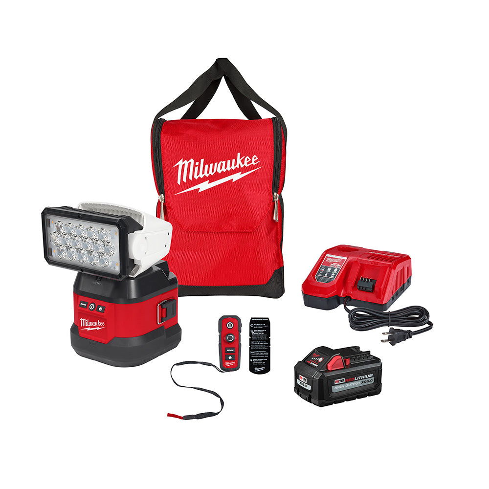 Milwaukee M18 search light kit with red portable base, remote control, charger, battery, and carrying bag.