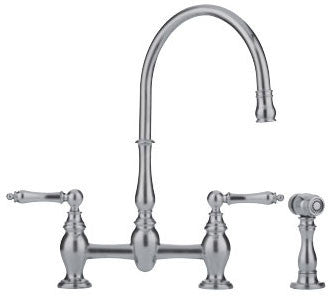 Satin nickel bridge faucet with curved gooseneck spout, dual traditional handles, and detached sidespray.
