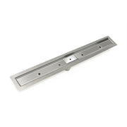 Polished stainless steel linear shower drain with rectangular grate and center control mechanism.