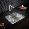 Stainless steel undermount single bowl sink with angular design, shown from above on dark countertop.