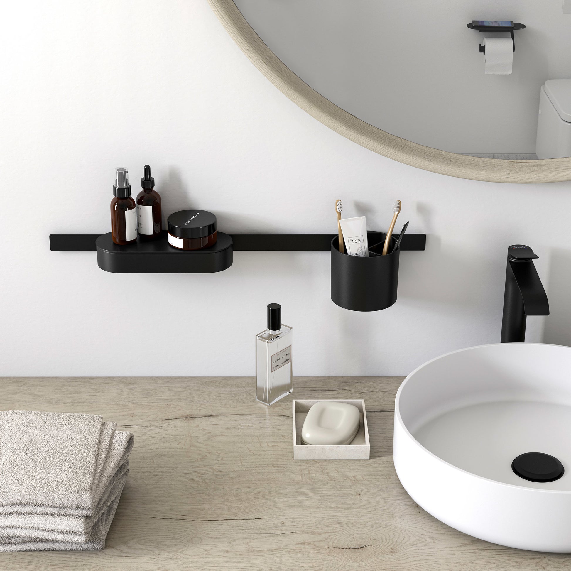 Matte black wall-mounted storage basket with cover, cylindrical shape, mounted on horizontal rail above bathroom sink.