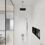 Chrome ceiling-mounted extension pipe with rectangular black showerhead, 12 inches long, installed in modern bathroom.