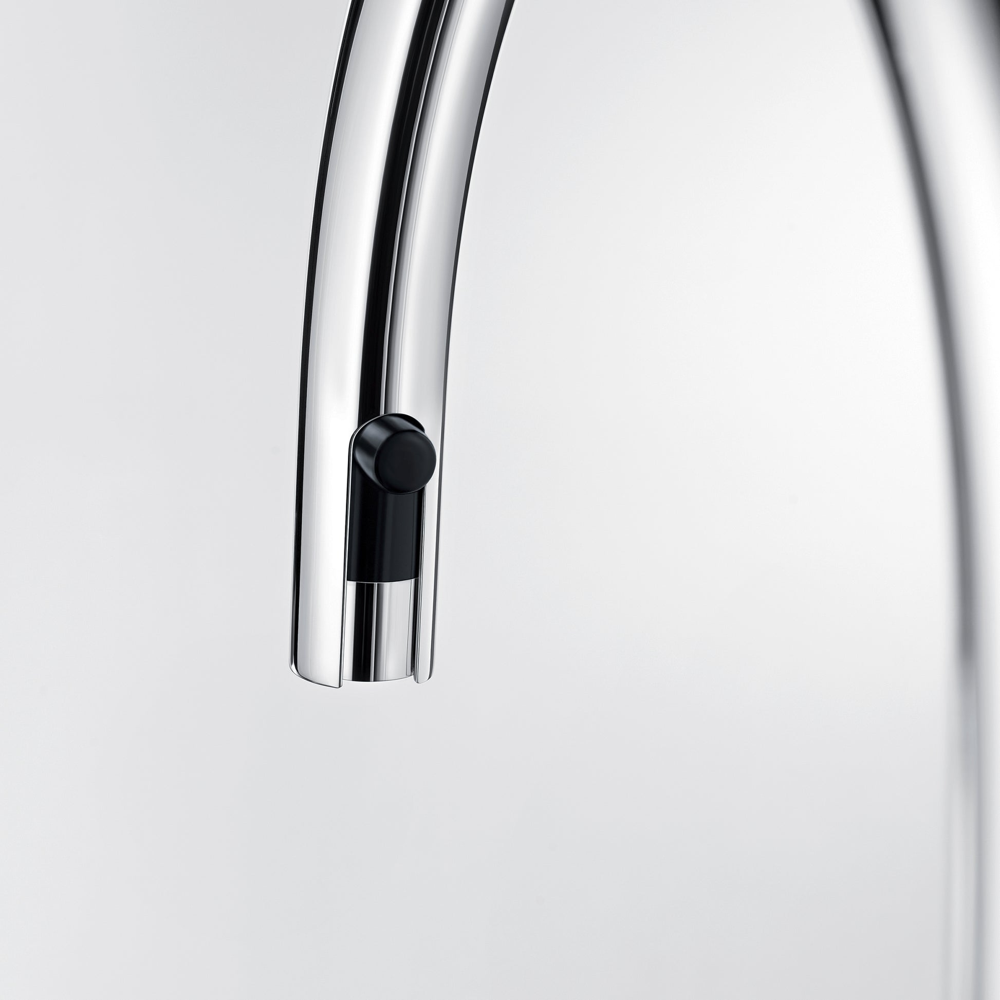 Chrome and coal black pull-down kitchen faucet spout with rounded nozzle and control button.