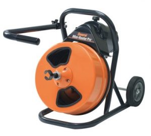 Orange and black drum-style drain cleaning machine on wheeled frame with black handle and cable attachment.