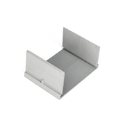 White and gray U-shaped linear drain component with sloped sides and rectangular opening at front.