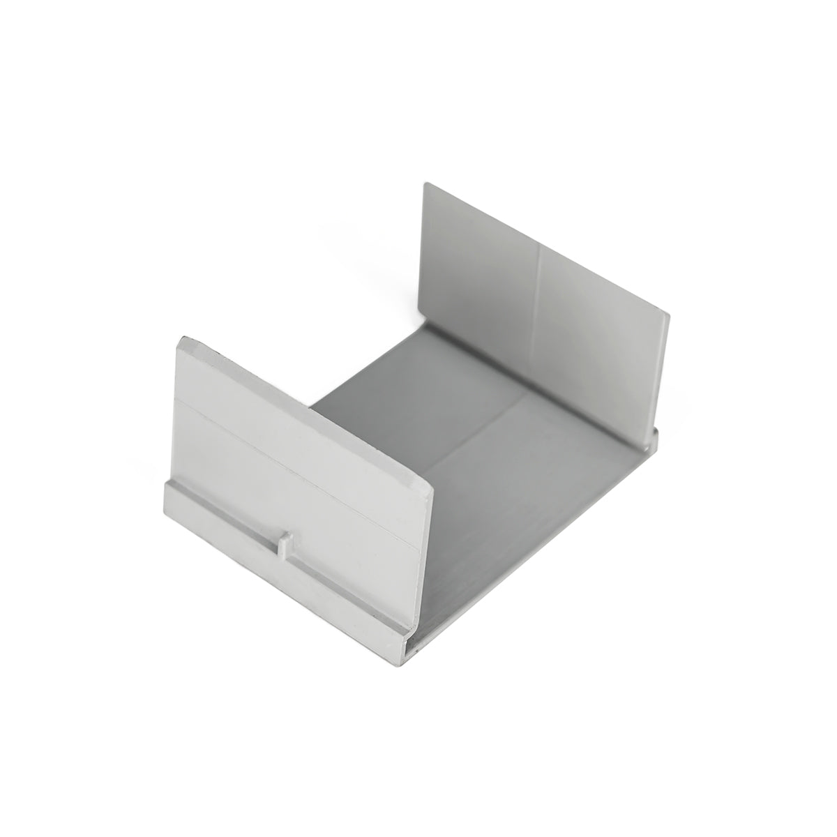 White and gray U-shaped linear drain component with sloped sides and rectangular opening at front.