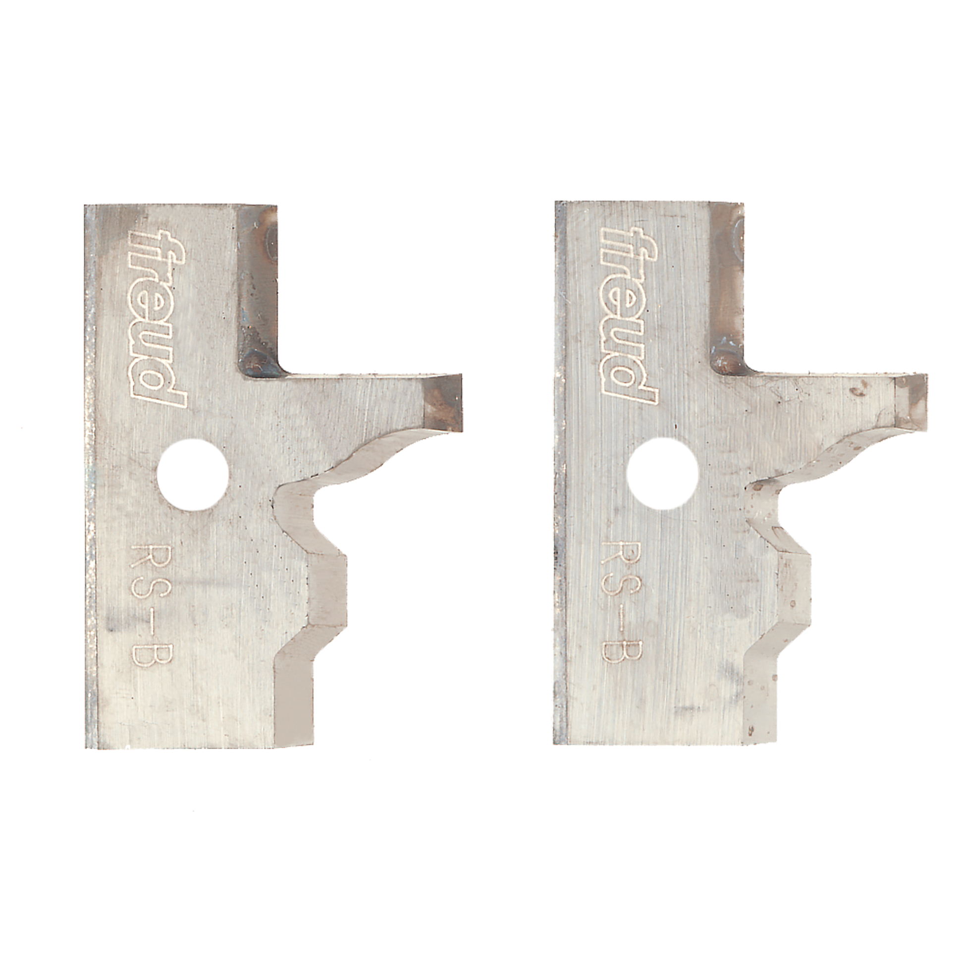 Two metal router knives with Freud branding, curved cutting edges, and mounting holes for rail and stile profiling.