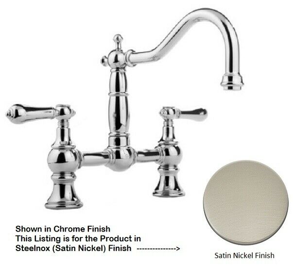 Polished chrome bridge-style kitchen faucet with curved spout, dual lever handles, and decorative spherical accents in satin 