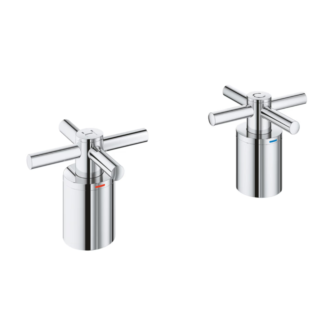 Pair of polished chrome cross handles with cylindrical bases for tub filler faucets.