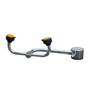 Stainless steel deck-mounted eyewash station with two orange and black eyecups connected by curved arms and control valve on 