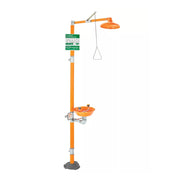 Floor-mounted safety station with orange pole, eyewash basin, overhead shower head, and instruction signage.