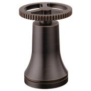 Venetian bronze faucet handle with ribbed wheel design and bell-shaped base.