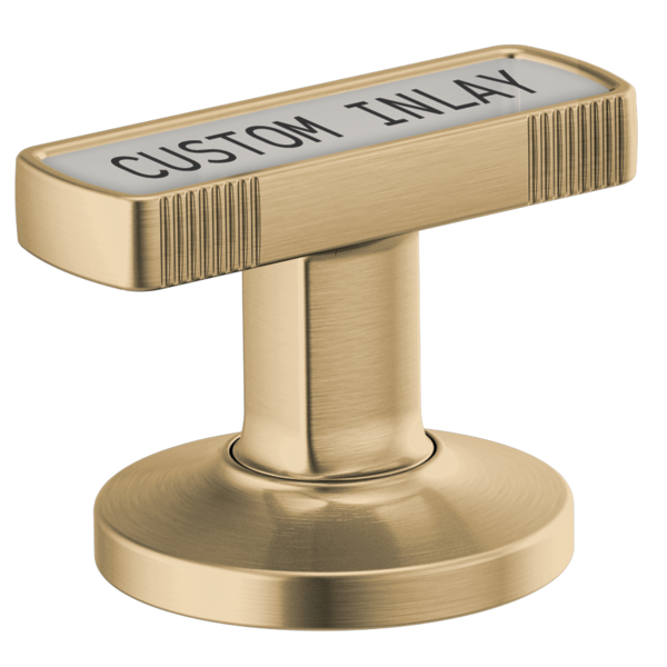 Brass faucet knob with rectangular handle featuring vertical ridges and "CUSTOM INLAY" text on top surface.