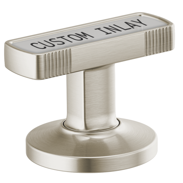 Brushed nickel T-shaped lavatory knob handle with "Custom Inlay" text and vertical ribbed detailing on rectangular top.