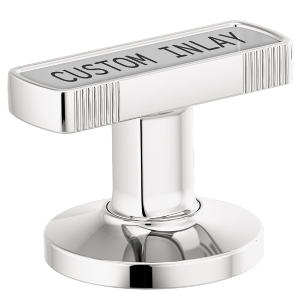 Chrome T-shaped faucet handle with vertical ribbed sides and custom inlay area on top, mounted on circular base.
