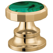 Polished gold faucet handle with malachite green stone inlay and faceted wheel knob design.