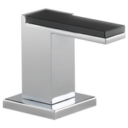 Chrome and dark glass faucet with rectangular spout and lever handles on square base.