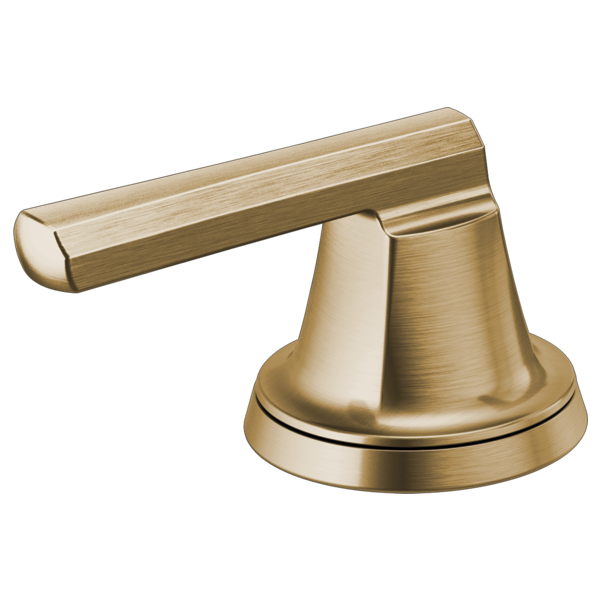 Brushed gold faucet handle with low lever arm and round base.
